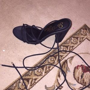 Nene black suede lace up heels.